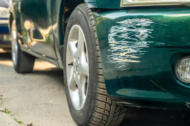 car featuring a damaged Front Bumper Popped Out Cost, illustrating the consequences of a collision or accident.